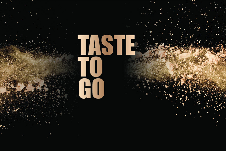 A graphic that reads Taste to Go, surrounded by seasonings bursting in the air