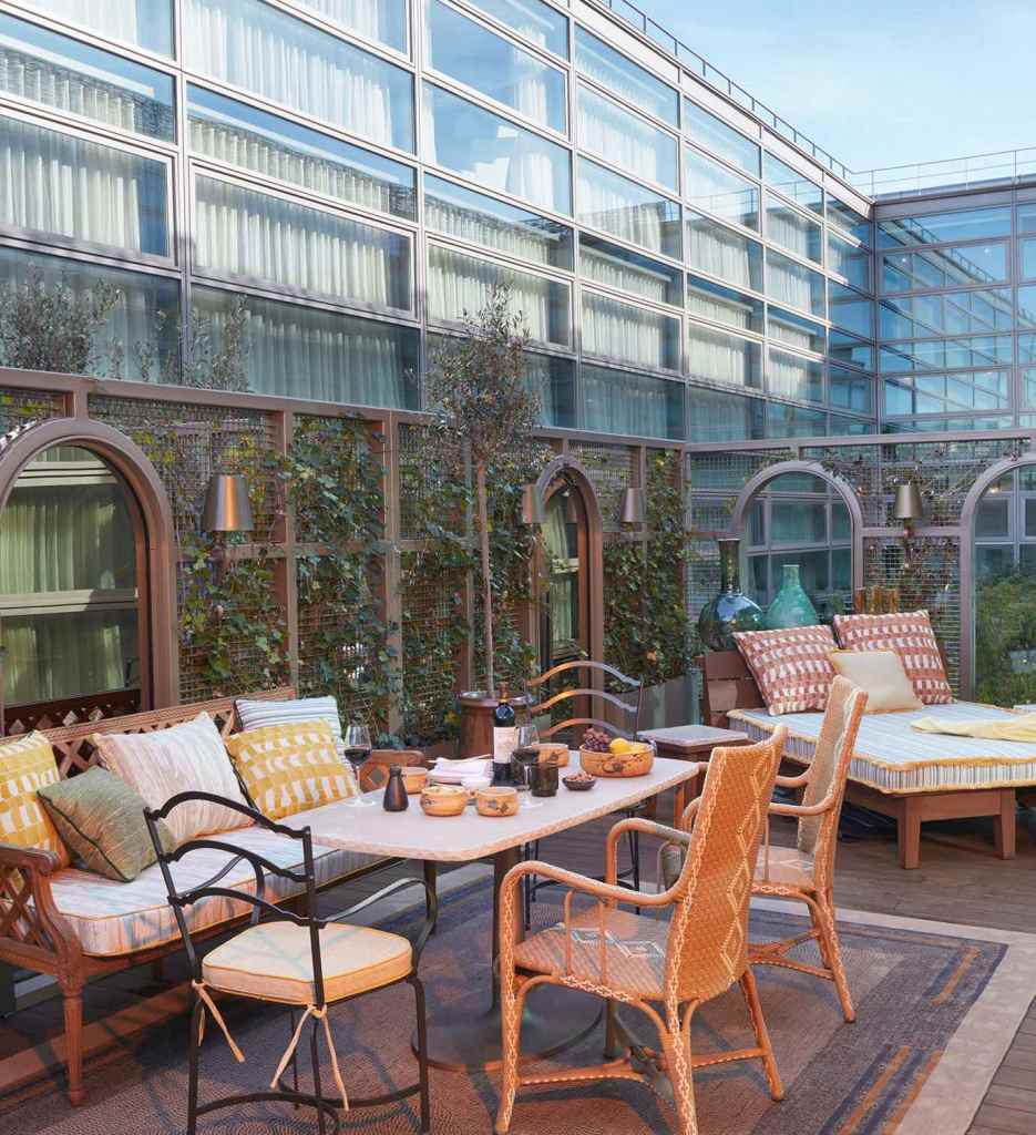 A patio with a table and chairs, providing a comfortable outdoor seating area.