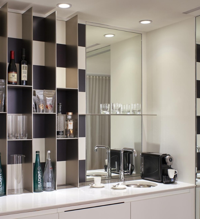 Black and white minibar with a coffee machine 