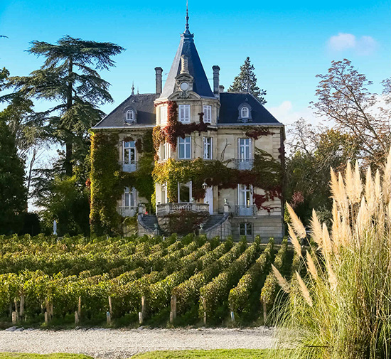 Château Les Carmes Haut-Brion in Bordeaux, with vineyards and estate in the background