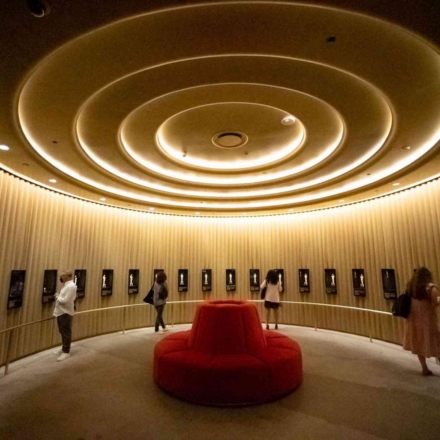 Interior of Academy Museum of Motion Pictures with Oscar trophies on the walls