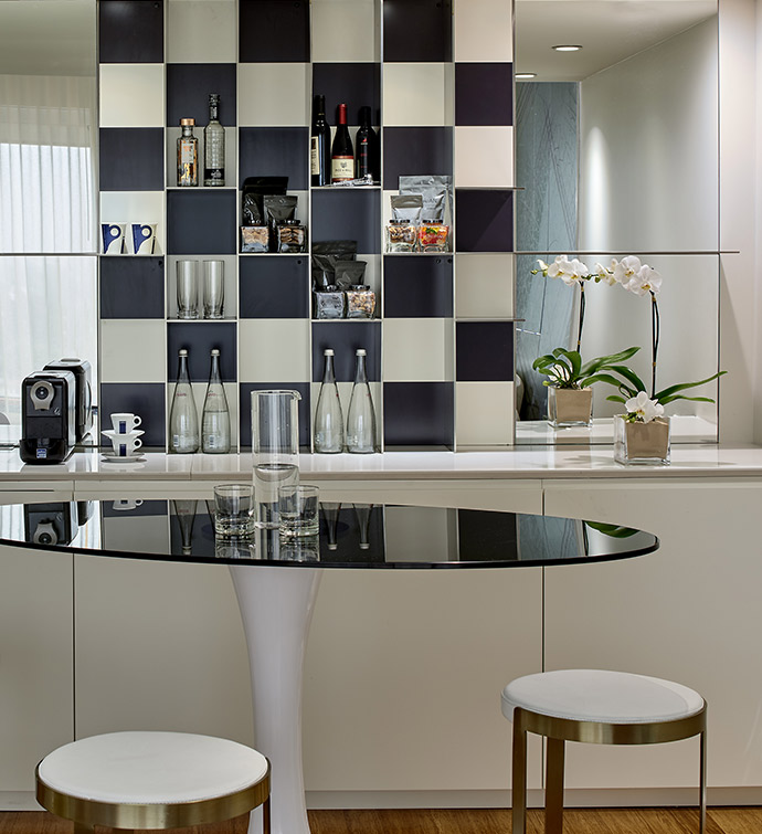 Monochrome checkered wall in a modern kitchen.