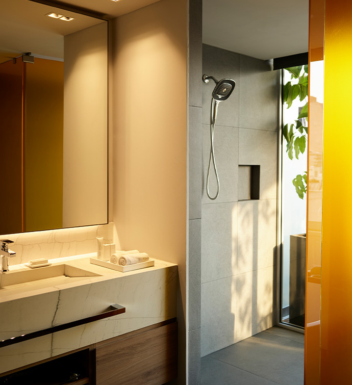 A modern bathroom with a sleek shower and a stylish sink.