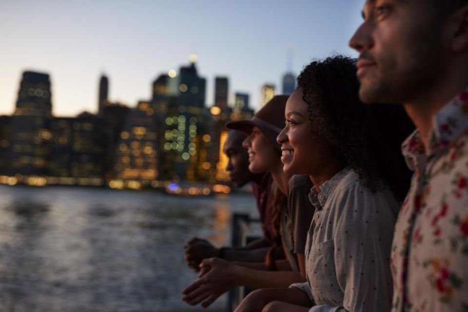 A group of people overlooking the water in New York City