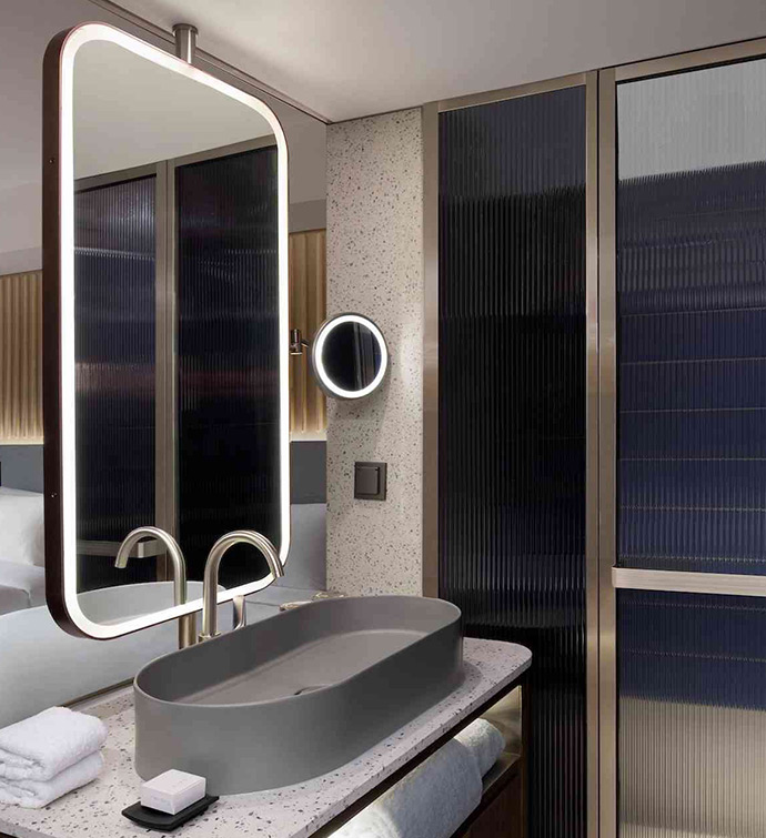 A contemporary bathroom featuring a sink and mirror.