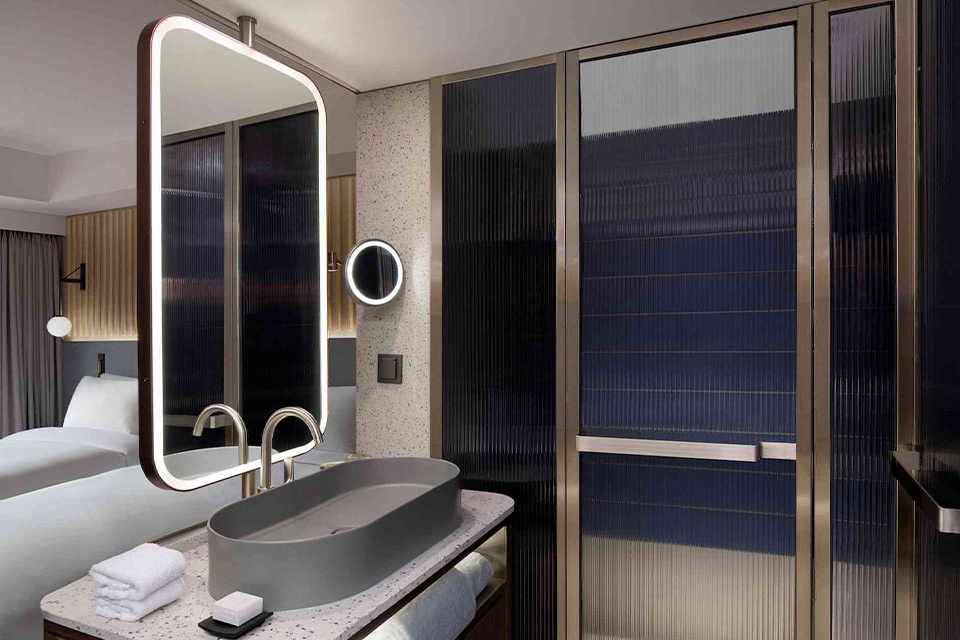 A contemporary bathroom featuring a sink and mirror.