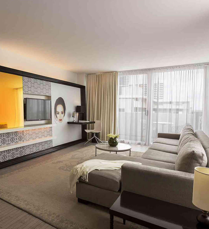 A contemporary hotel room with a spacious TV.