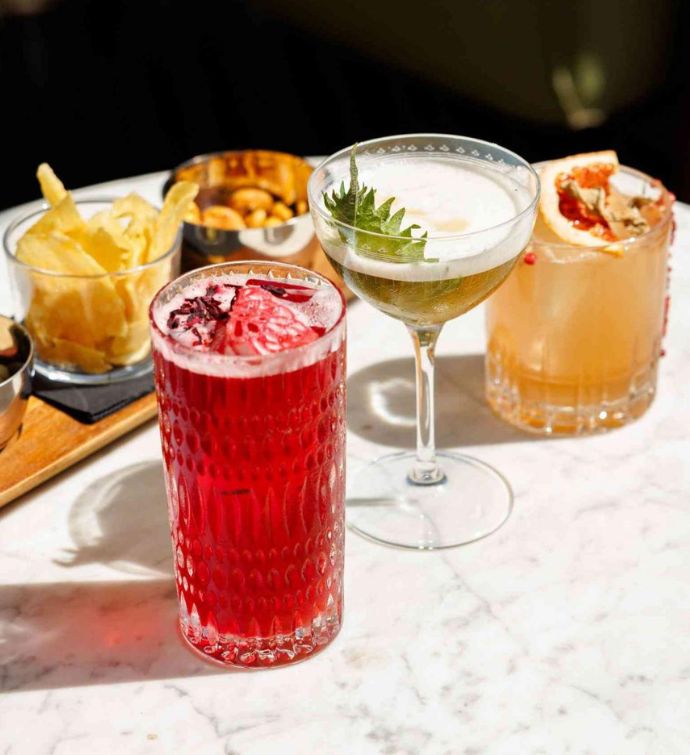 Colorful cocktails and bar snacks