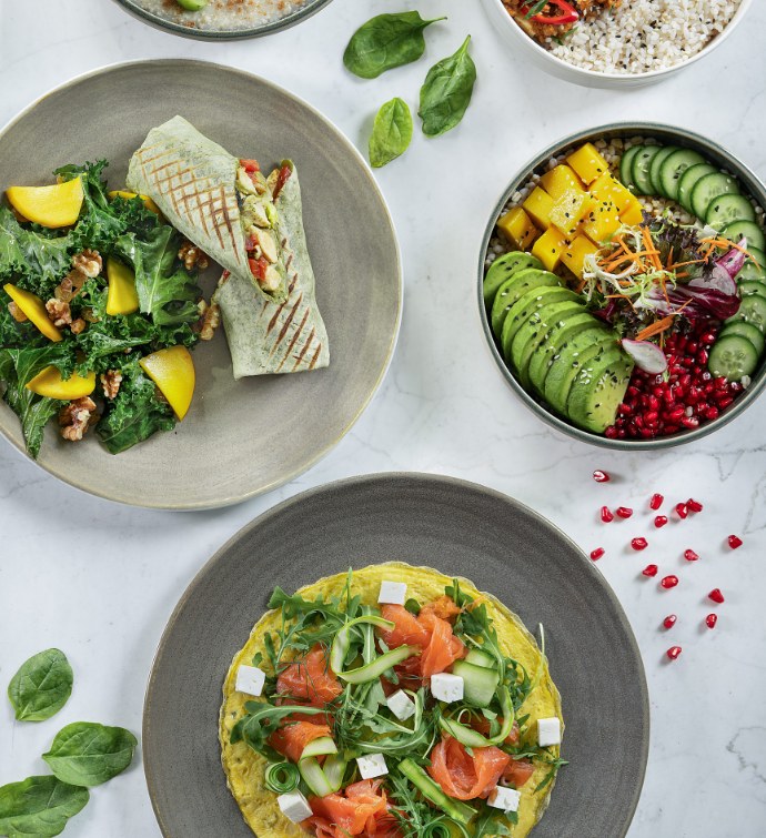 Fresh salads, sandwiches and bowls as part of EllaMia Doha's healthy menu