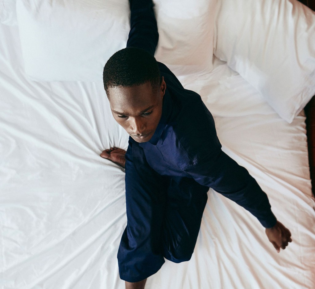 Man sitting on a bed
