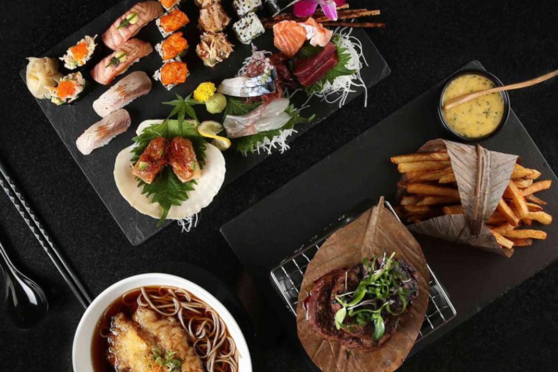 Platter of sushi accompanied by steak and fries at Morimoto Doha