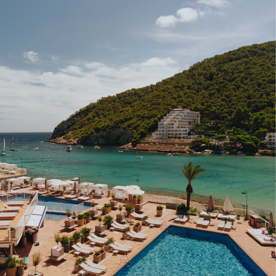 Hyde Beach Ibiza at Mondrian Ibiza with multiple pools and daybeds overlooking the water