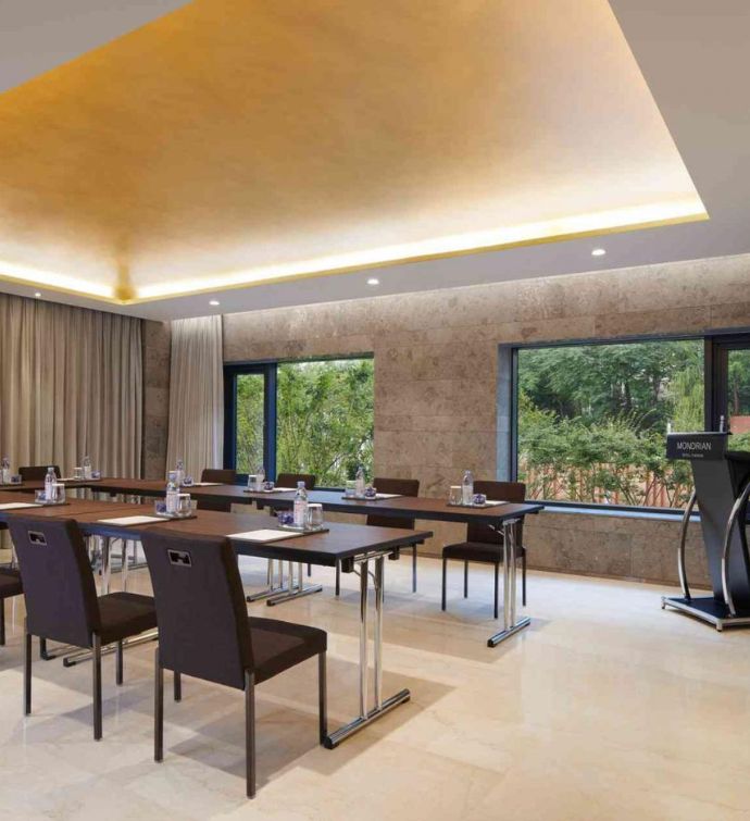 Modern meeting room set up with chairs and desks in a classroom style setting