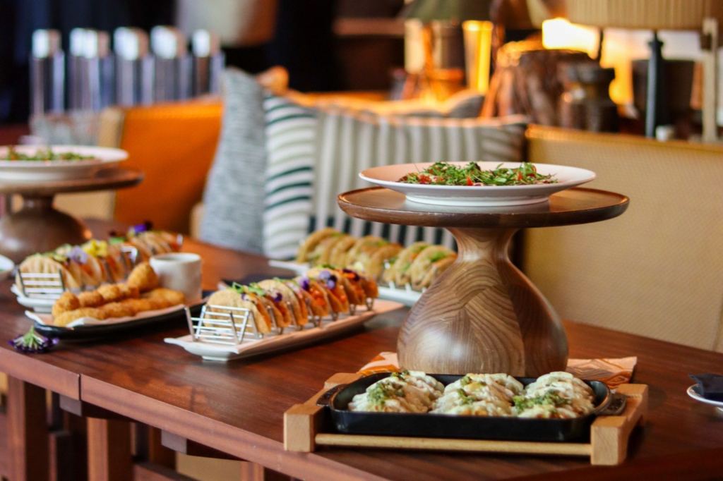 Array of sushi arranged on platters at an event