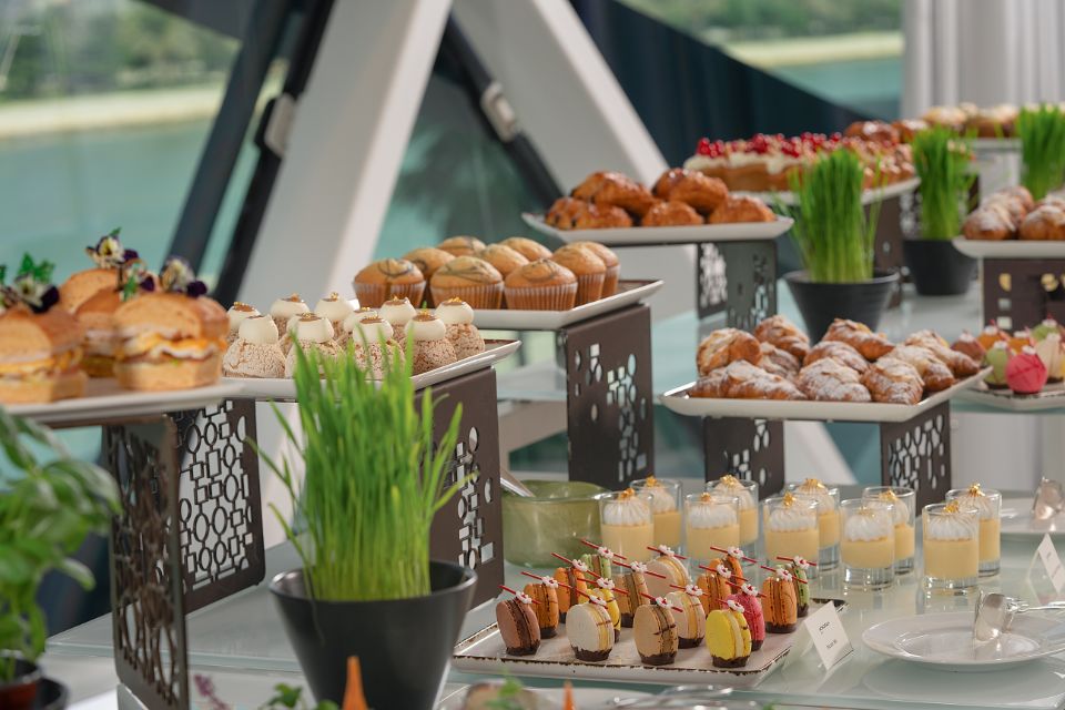 Desserts on various trays on a buffet table