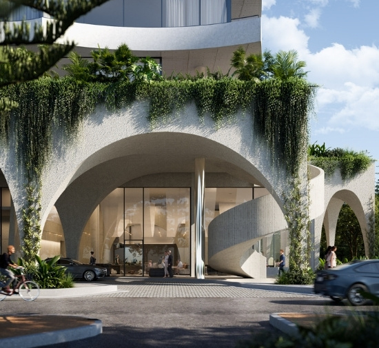 Outdoor facade of a grey building with arches and greenery spilling down